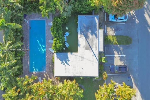 an aerial view of a house with a garden
