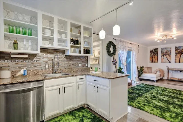 a kitchen with cabinets and window