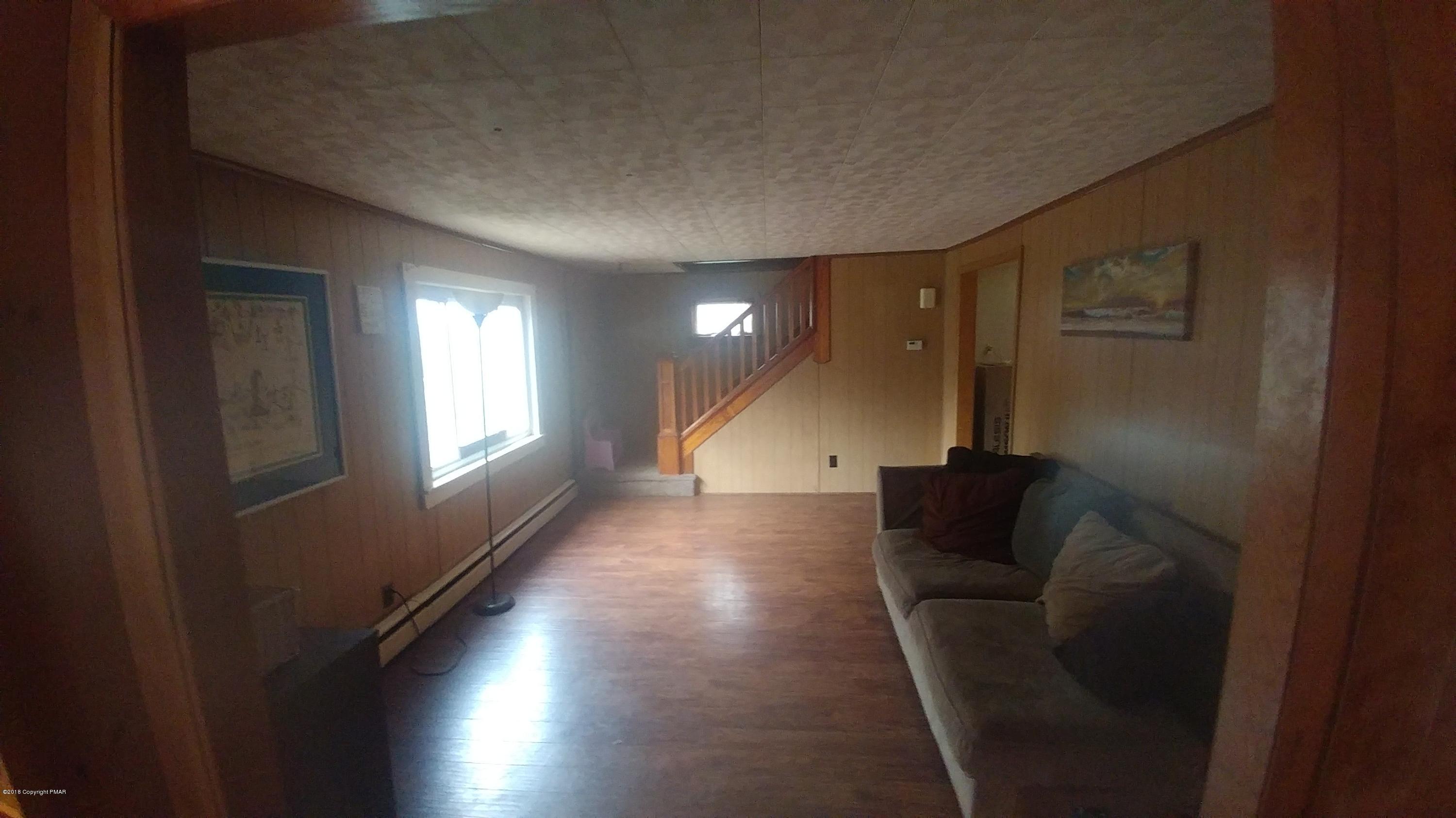604 Lilly Lake Road Wapwallopen, PA 18660 - Photo 12 of 16 a living room with furniture and a window