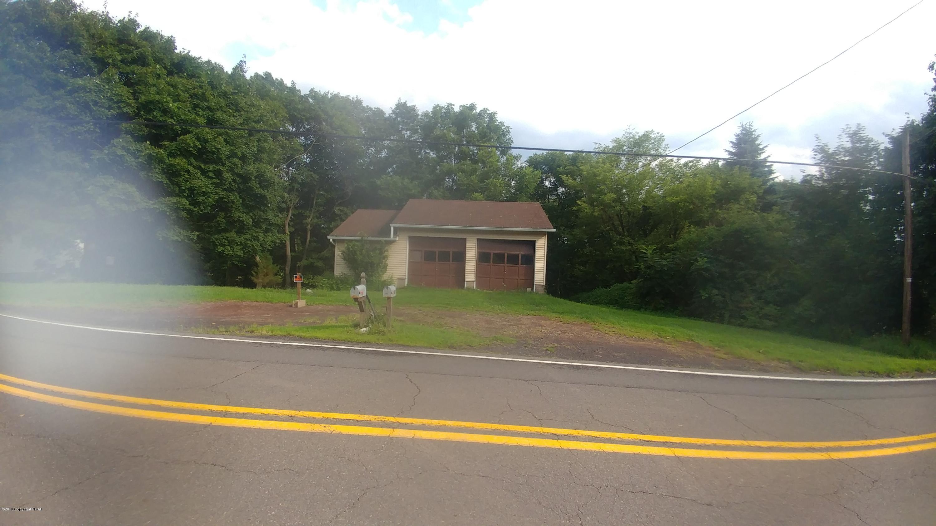 604 Lilly Lake Road Wapwallopen, PA 18660 - Photo 2 of 16 a view of swimming pool with palm trees