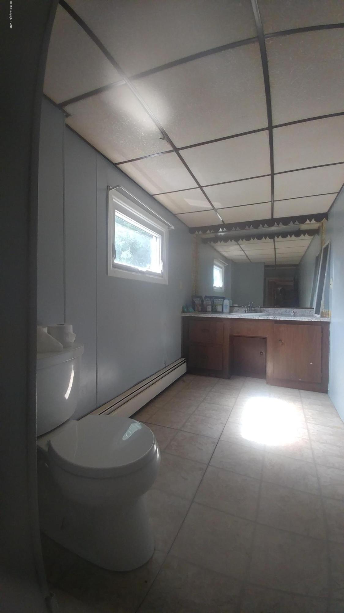 604 Lilly Lake Road Wapwallopen, PA 18660 - Photo 4 of 16 a room with furniture and a ceiling fan