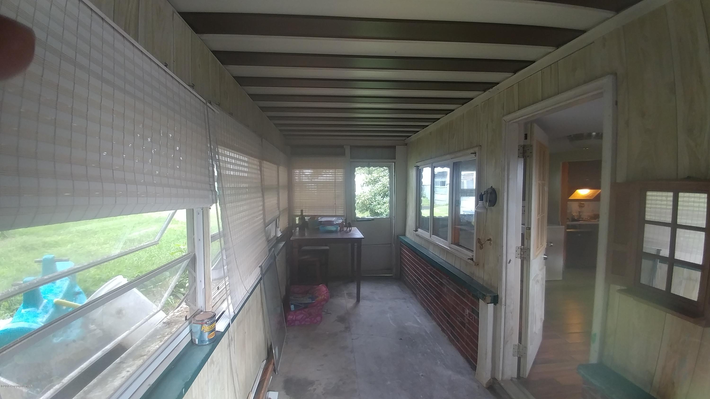 604 Lilly Lake Road Wapwallopen, PA 18660 - Photo 5 of 16 a view of a hallway with windows