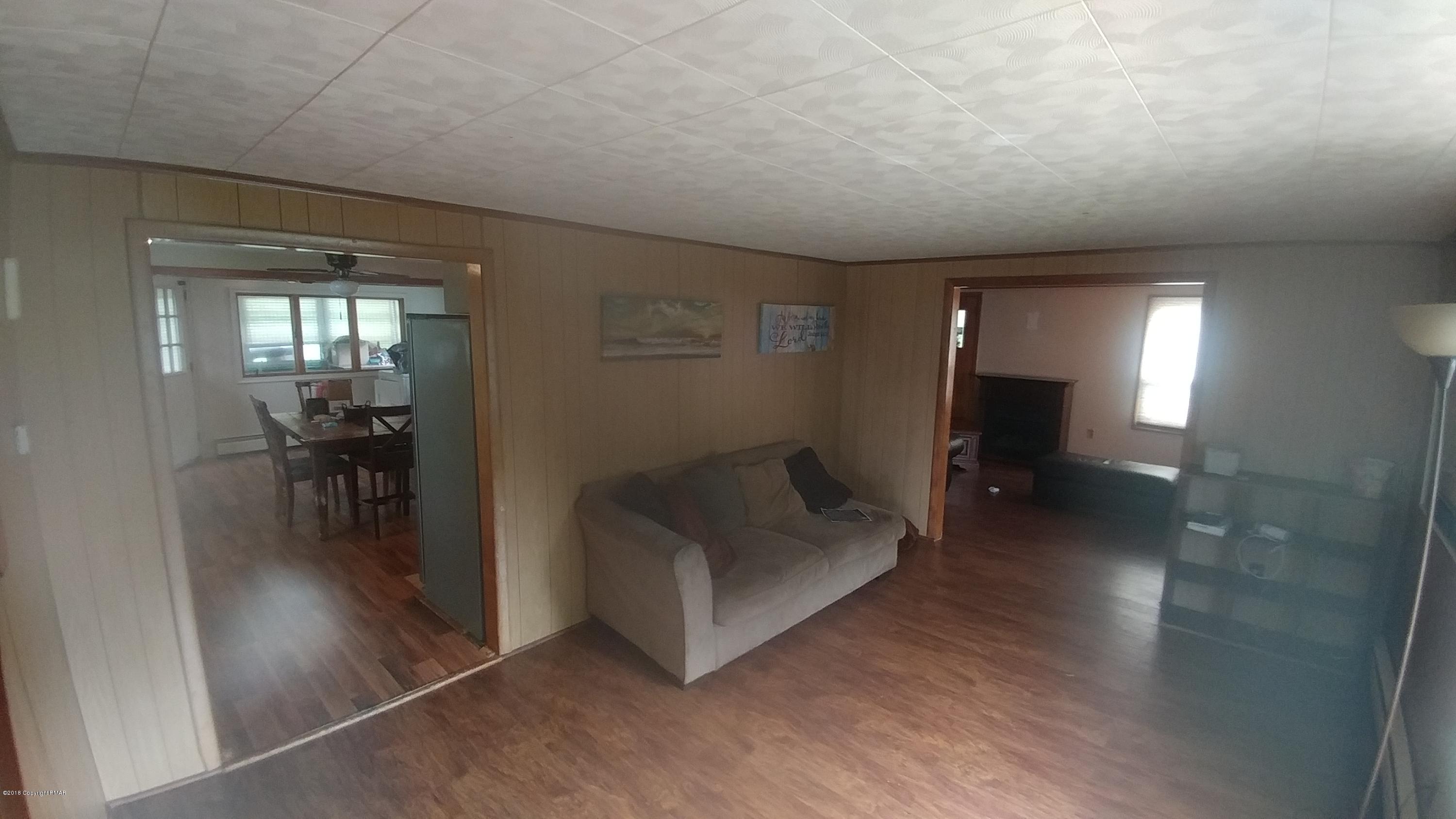 604 Lilly Lake Road Wapwallopen, PA 18660 - Photo 6 of 16 a view of livingroom with furniture and workspace