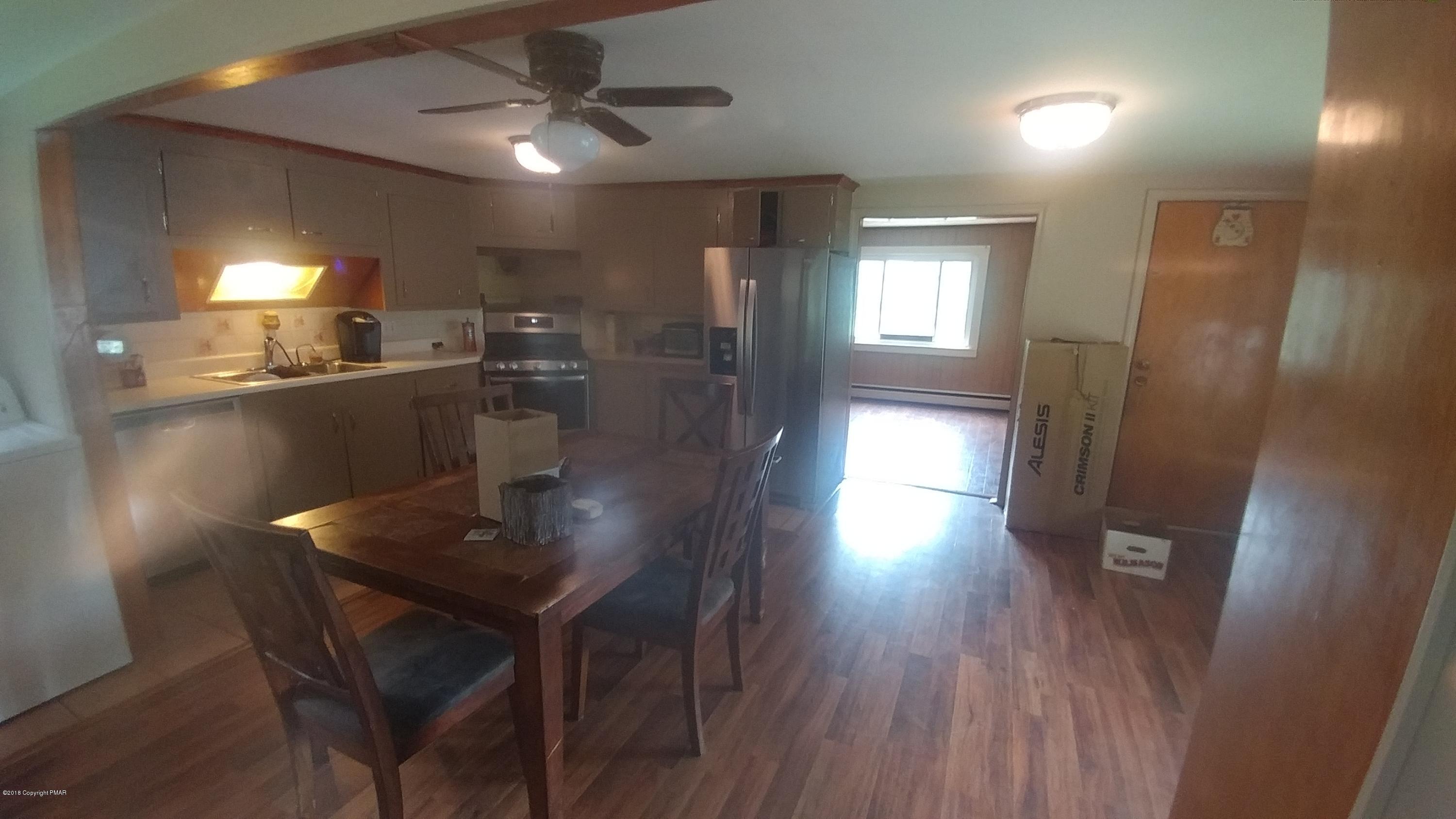 604 Lilly Lake Road Wapwallopen, PA 18660 - Photo 8 of 16 a dining room with furniture and wooden floor