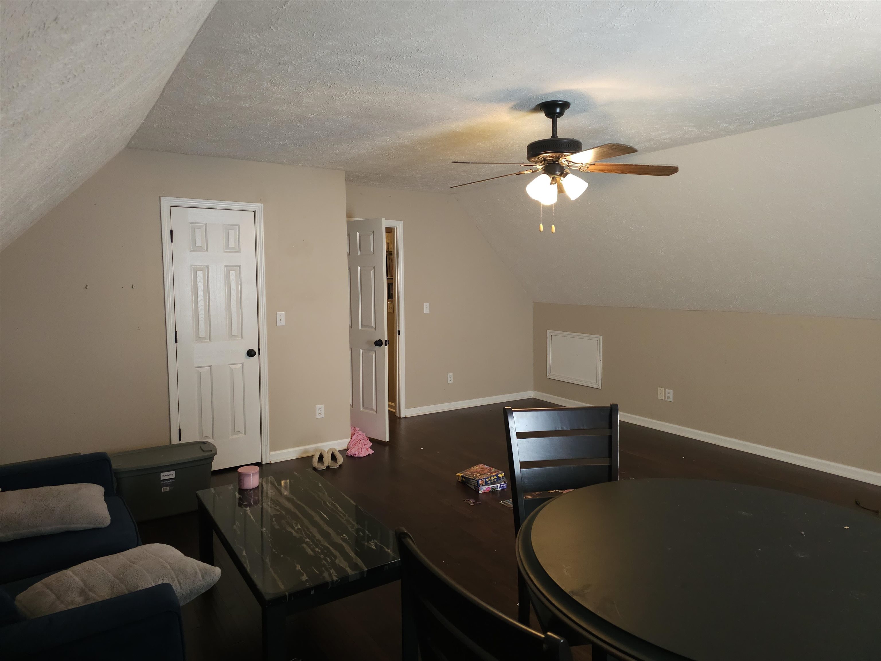 109 Sebastian Drive Jackson, TN 38305 - Photo 13 of 24 Additional living space featuring ceiling fan and dark wood-style flooring