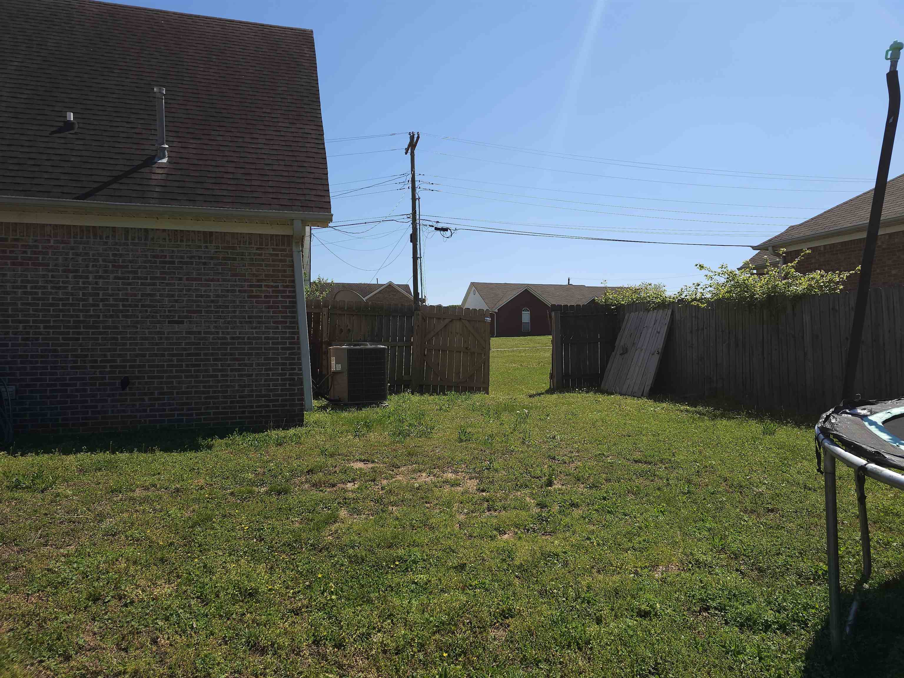 109 Sebastian Drive Jackson, TN 38305 - Photo 22 of 24 Fenced backyard with a trampoline