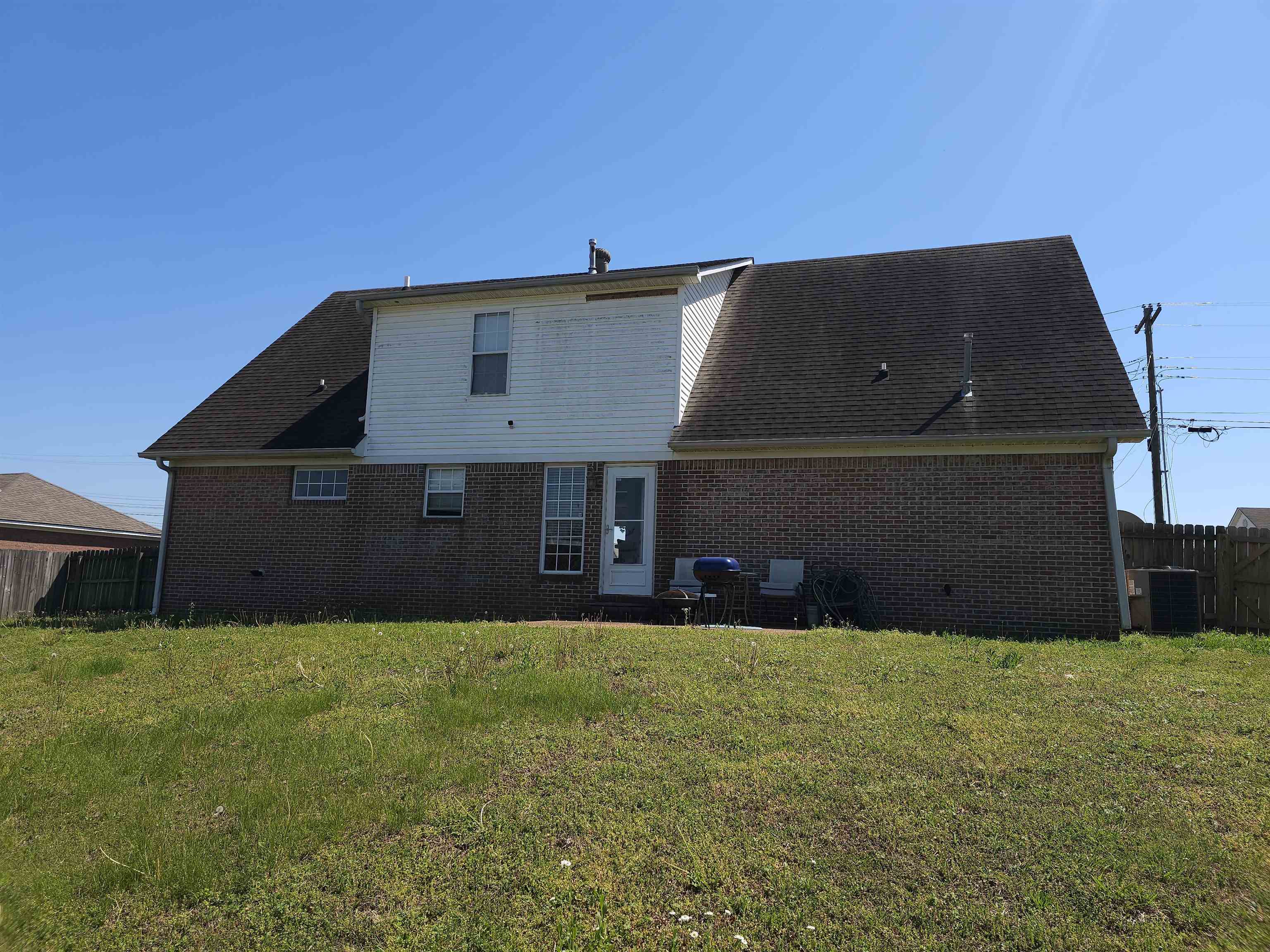 109 Sebastian Drive Jackson, TN 38305 - Photo 23 of 24 Rear view of property featuring brick siding, a patio, and a shingled roof