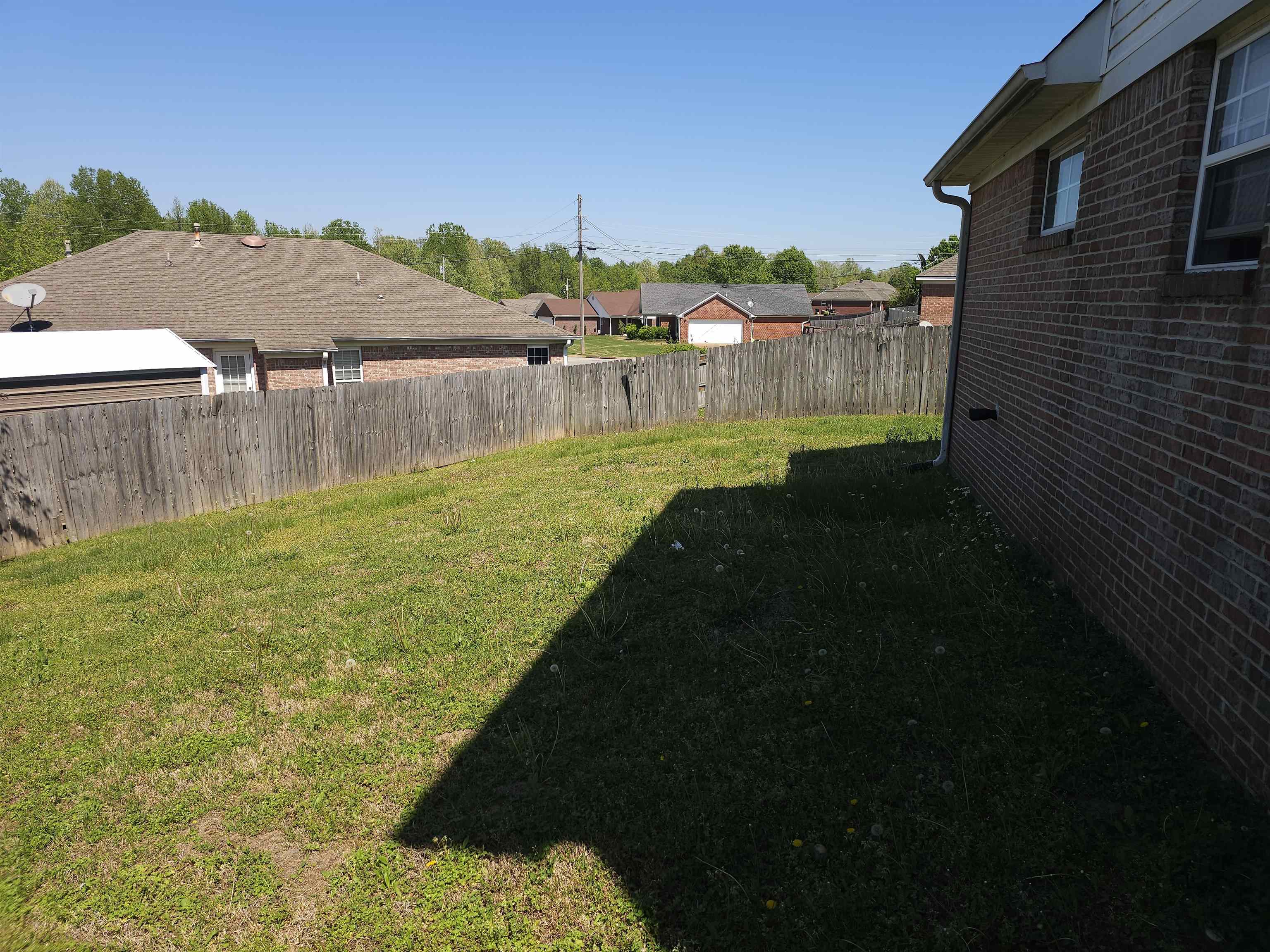 109 Sebastian Drive Jackson, TN 38305 - Photo 24 of 24 Fenced backyard with a residential view