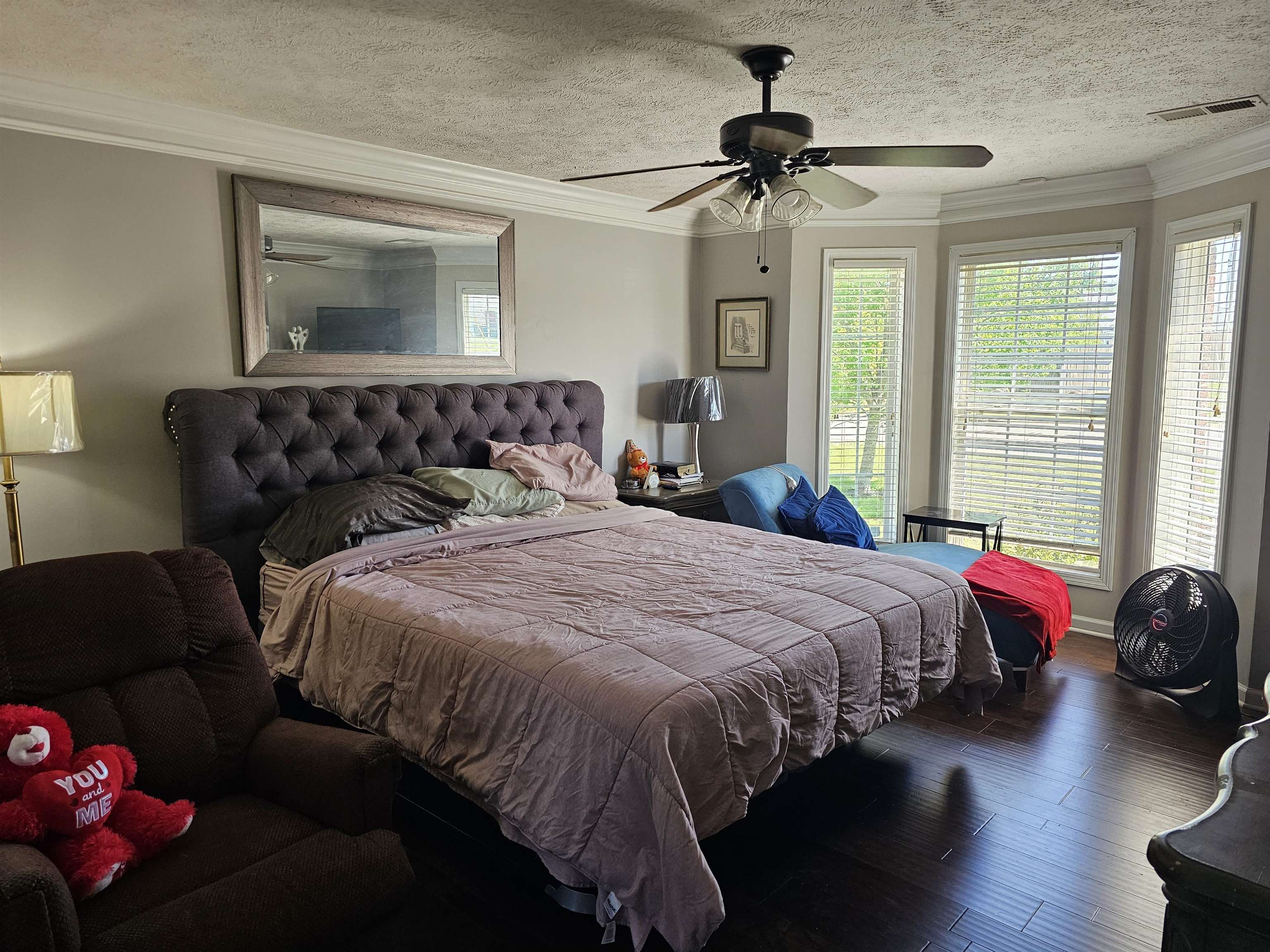 109 Sebastian Drive Jackson, TN 38305 - Photo 8 of 24 Bedroom with ornamental molding, wood finished floors, a textured ceiling, and a ceiling fan