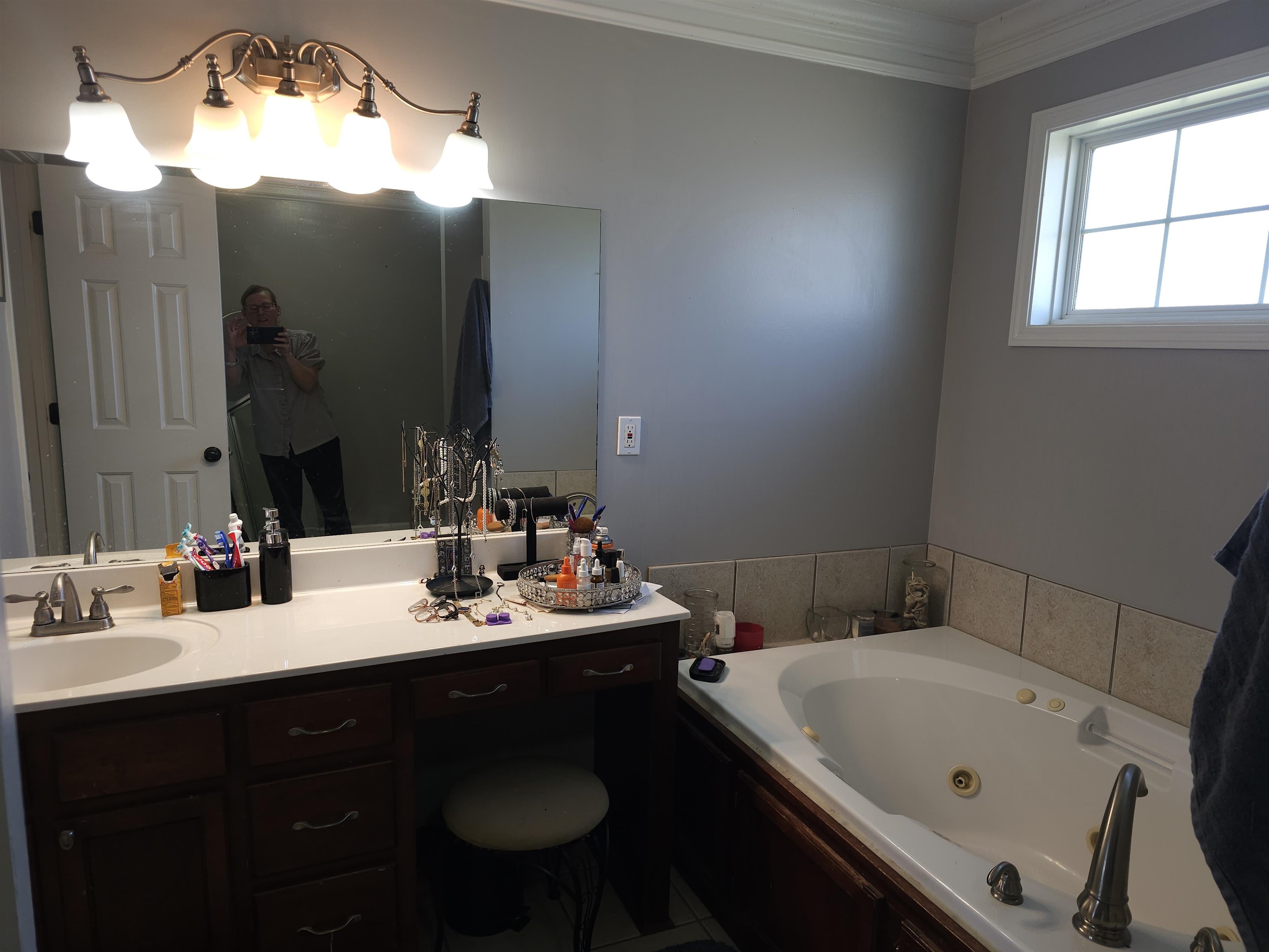 109 Sebastian Drive Jackson, TN 38305 - Photo 10 of 24 Full bath featuring vanity, crown molding, and a whirlpool tub