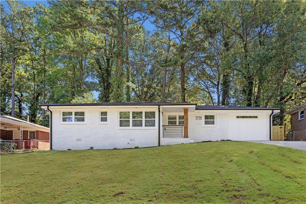 2228 Glendale Drive Decatur, GA 30032 - Photo 1 of 1 a view of a backyard with a garden and tree