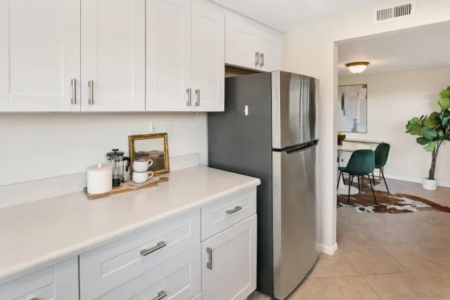a kitchen with appliances and cabinets