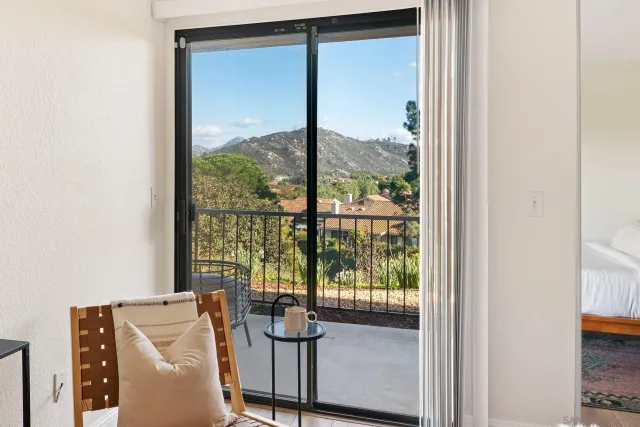 a view of a room with a large window