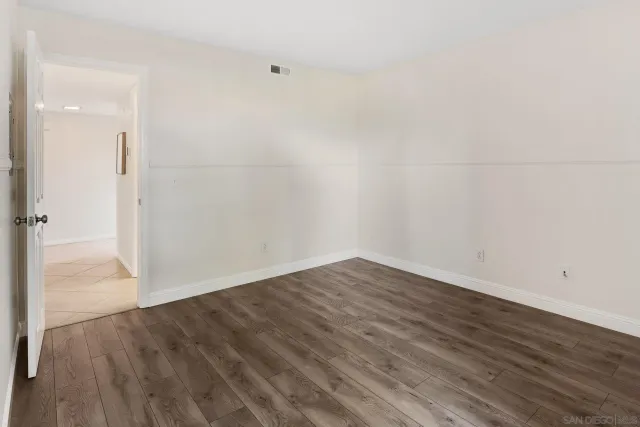 a view of a small space with wooden floor