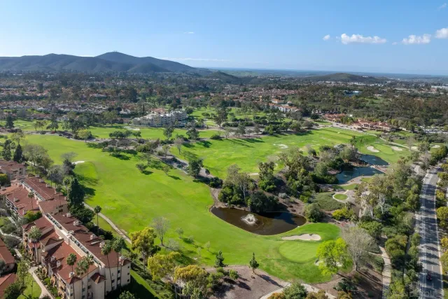 a view of a city with mountains in the background
