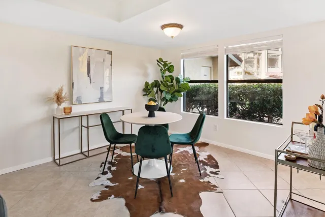 a view of a dining room with furniture window and outside view
