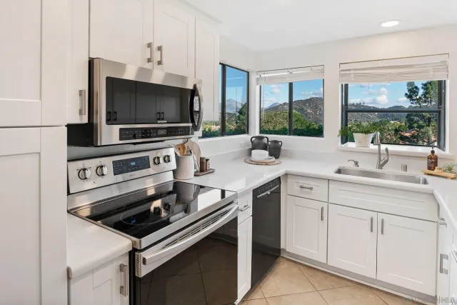 a kitchen with a stove and a sink