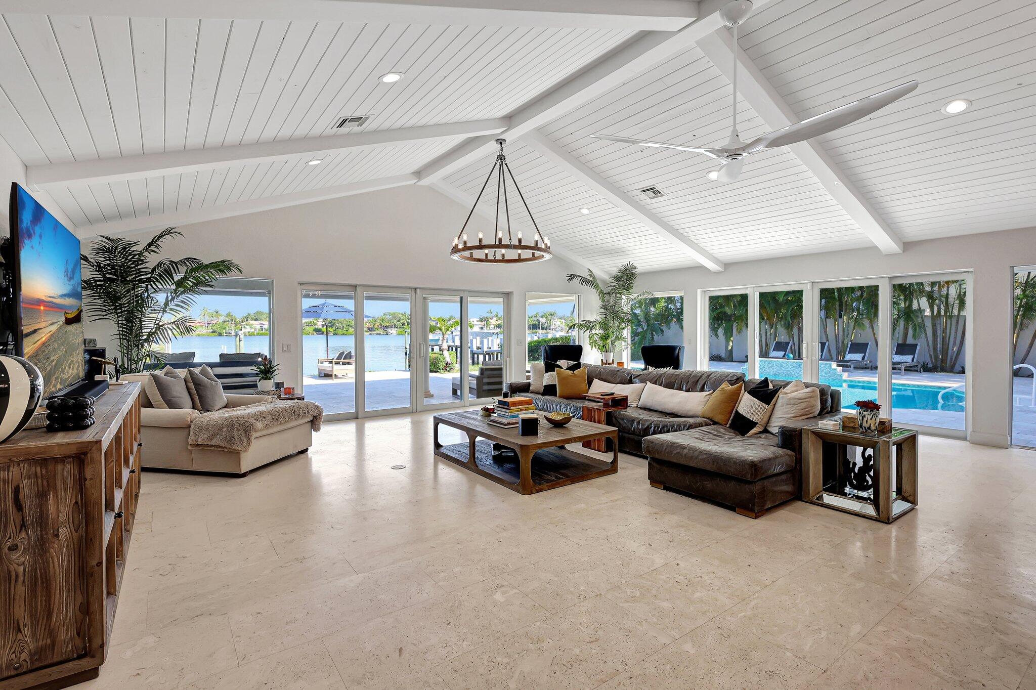 18896 Point Drive Tequesta, FL 33469 - Photo 22 of 62 a living room with furniture and a large window