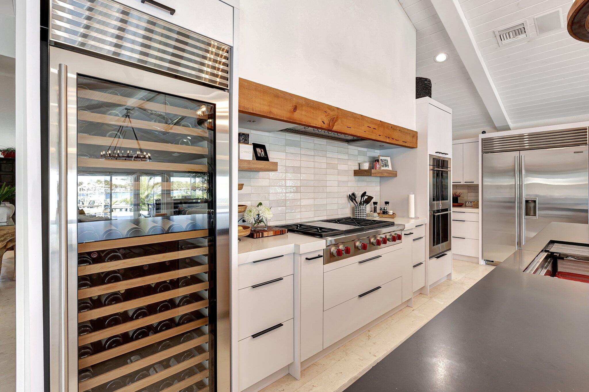 18896 Point Drive Tequesta, FL 33469 - Photo 25 of 62 a kitchen with stove and cabinets