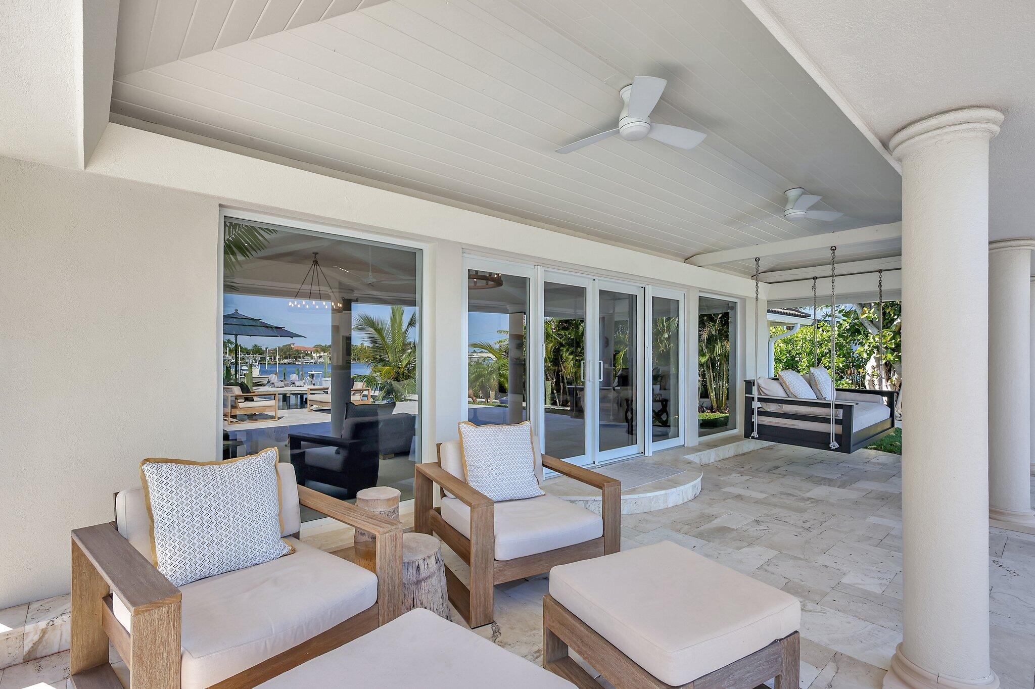 18896 Point Drive Tequesta, FL 33469 - Photo 34 of 62 a living room with furniture and a window