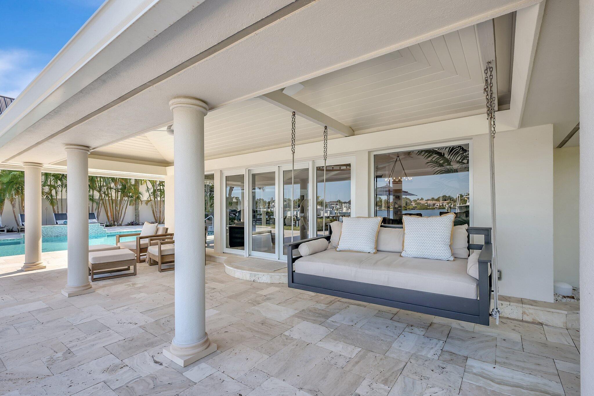18896 Point Drive Tequesta, FL 33469 - Photo 35 of 62 a living room with fireplace furniture and a large window