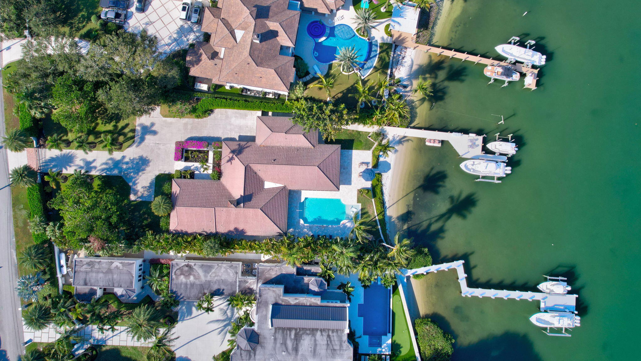 18896 Point Drive Tequesta, FL 33469 - Photo 10 of 62 an aerial view of a house with a garden