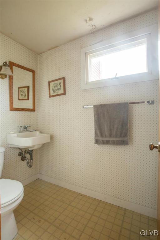 6293 Sullivan Trail Nazareth, PA 18064 - Photo 10 of 32 a bathroom with a sink a toilet and mirror
