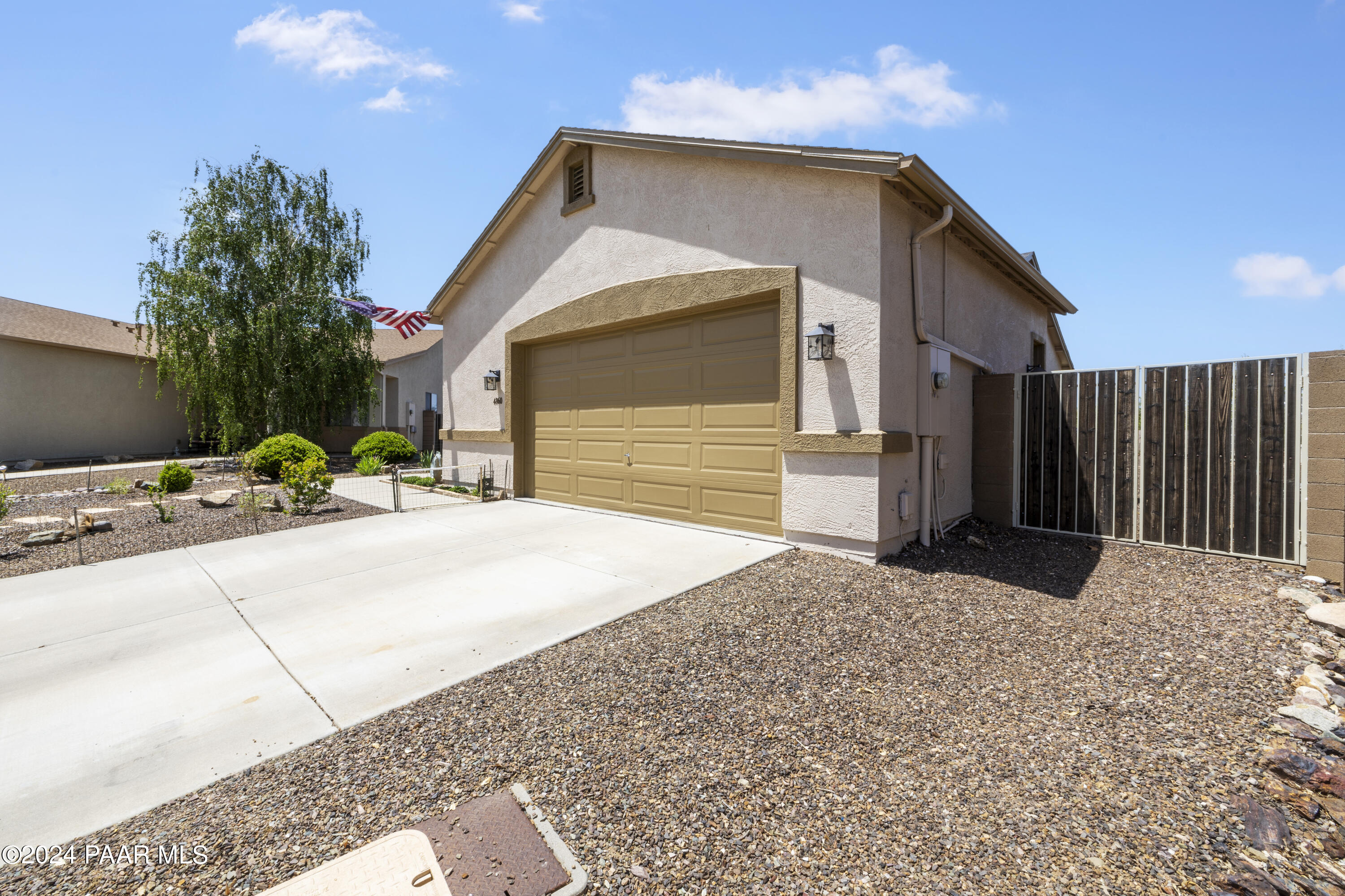 4860 Edgemont Road Prescott Valley, AZ 86314 - Photo 3 of 32 a front view of a house with a yard