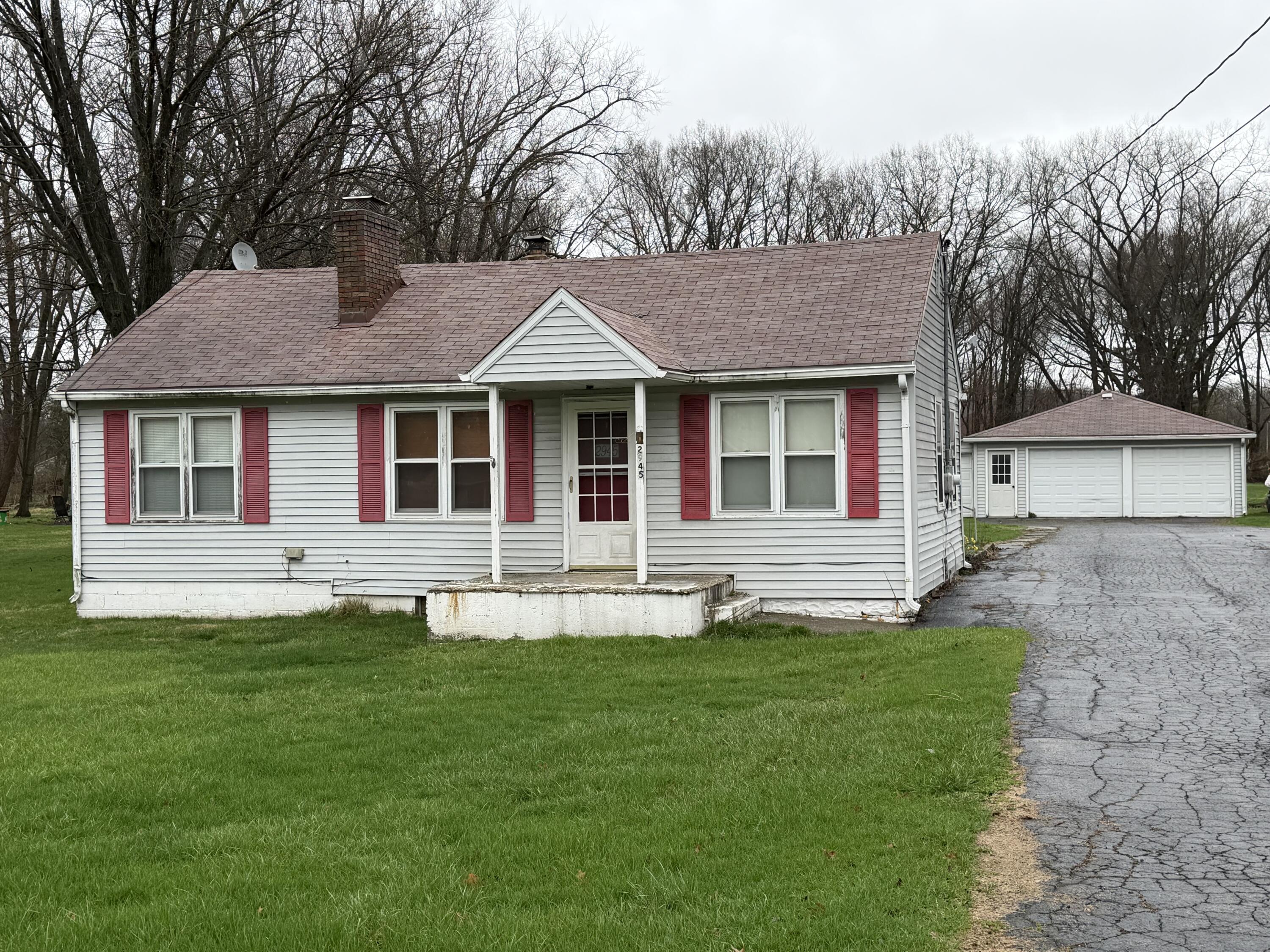 2945 Monnier Street Portage, IN 46368 - Photo 1 of 32 a front view of a house with a yard and trees