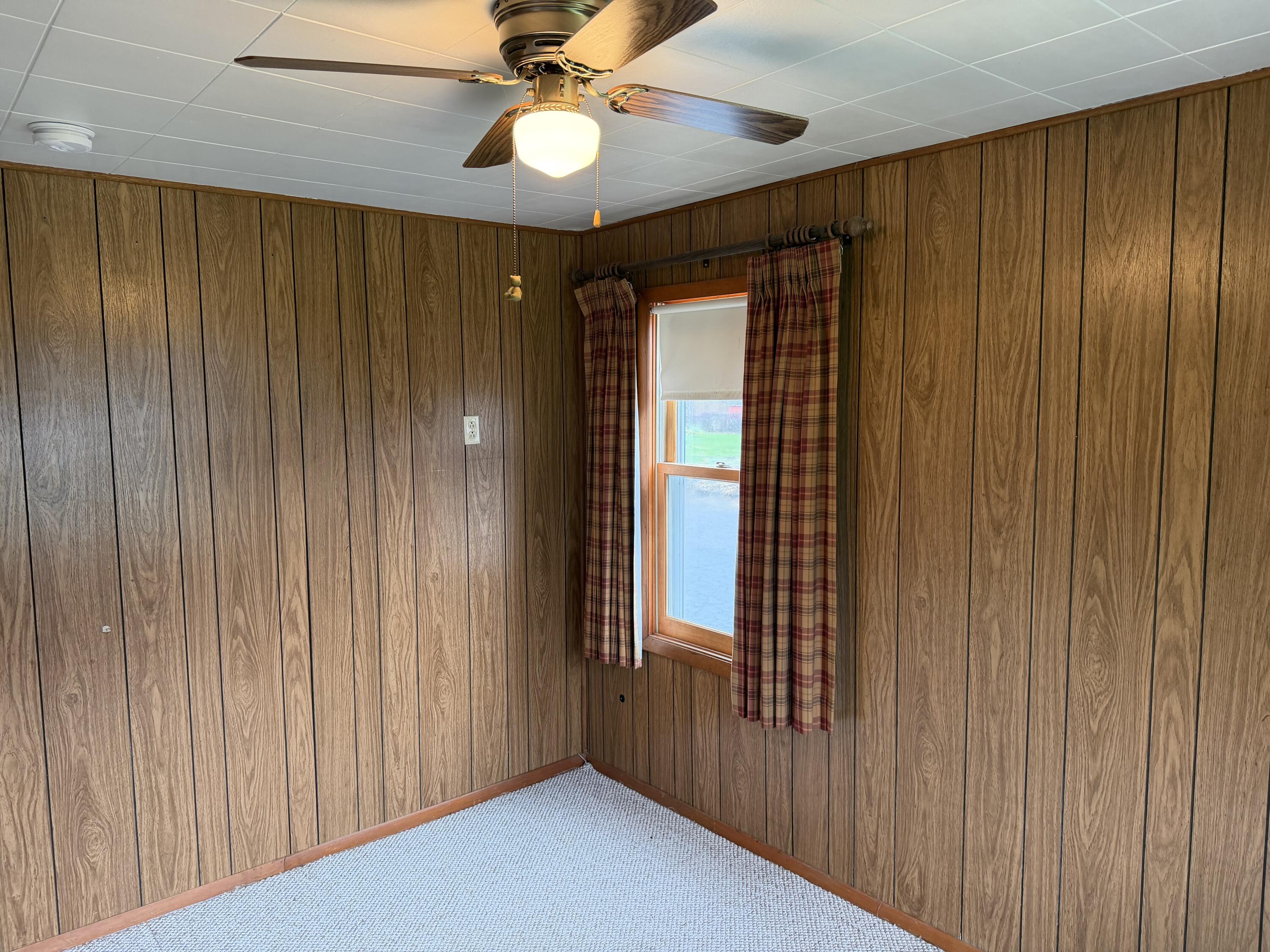 2945 Monnier Street Portage, IN 46368 - Photo 16 of 32 wooden floor in an empty room with a window