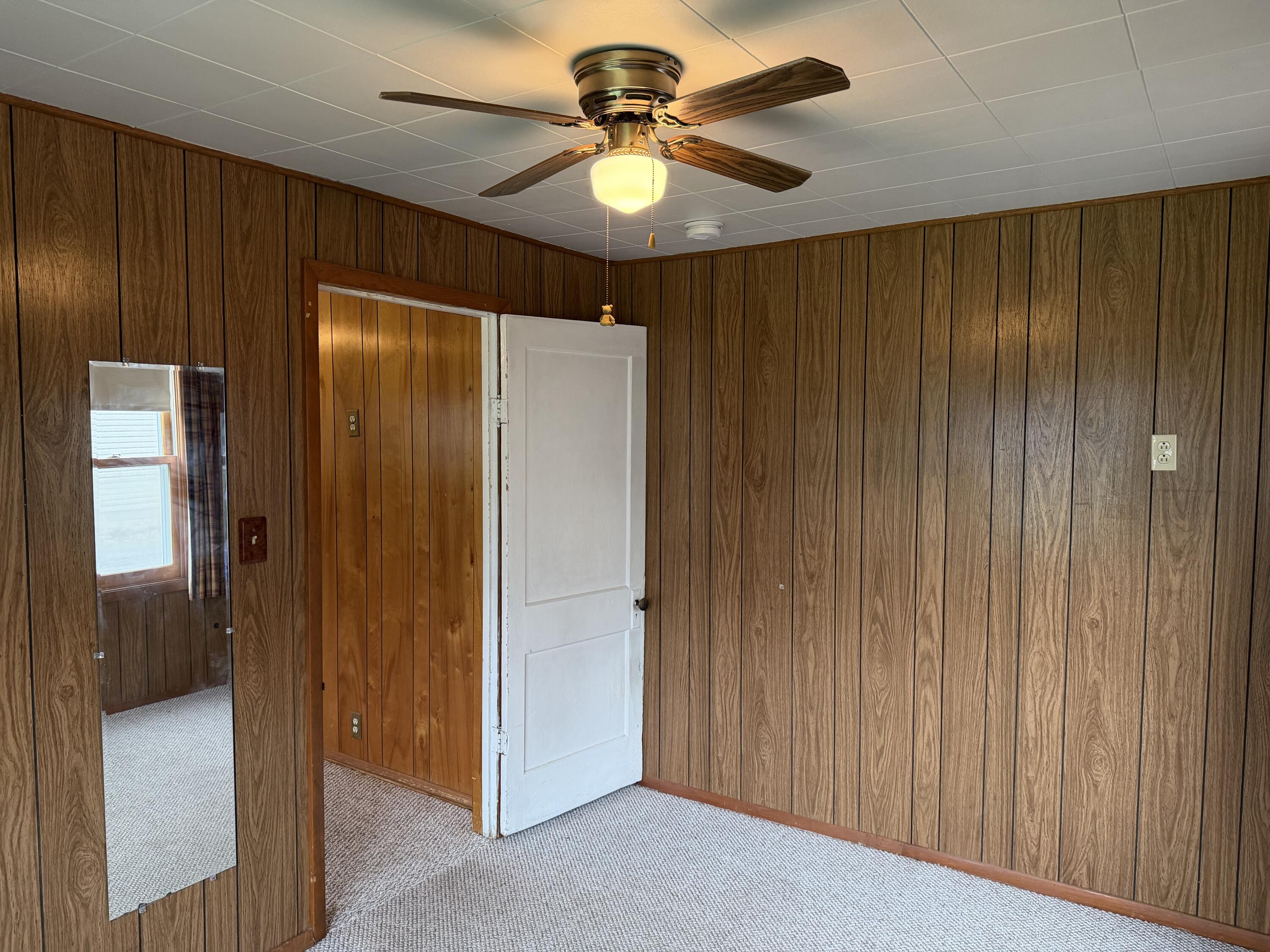 2945 Monnier Street Portage, IN 46368 - Photo 17 of 32 a view of a livingroom with a chandelier fan