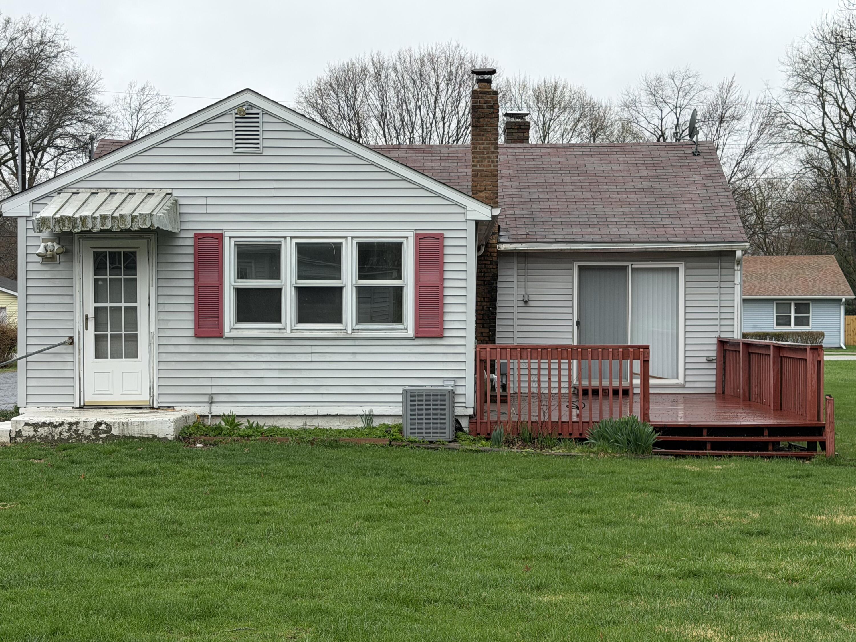 2945 Monnier Street Portage, IN 46368 - Photo 25 of 32 a front view of a house with a garden and deck