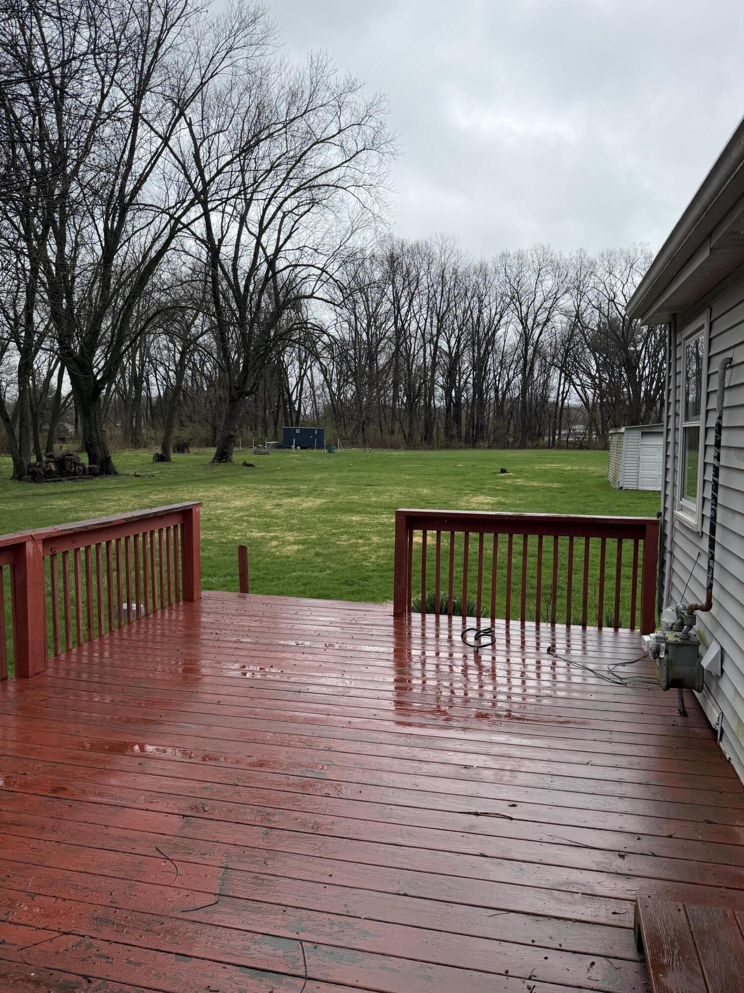 2945 Monnier Street Portage, IN 46368 - Photo 29 of 32 an outdoor view of a garden and deck