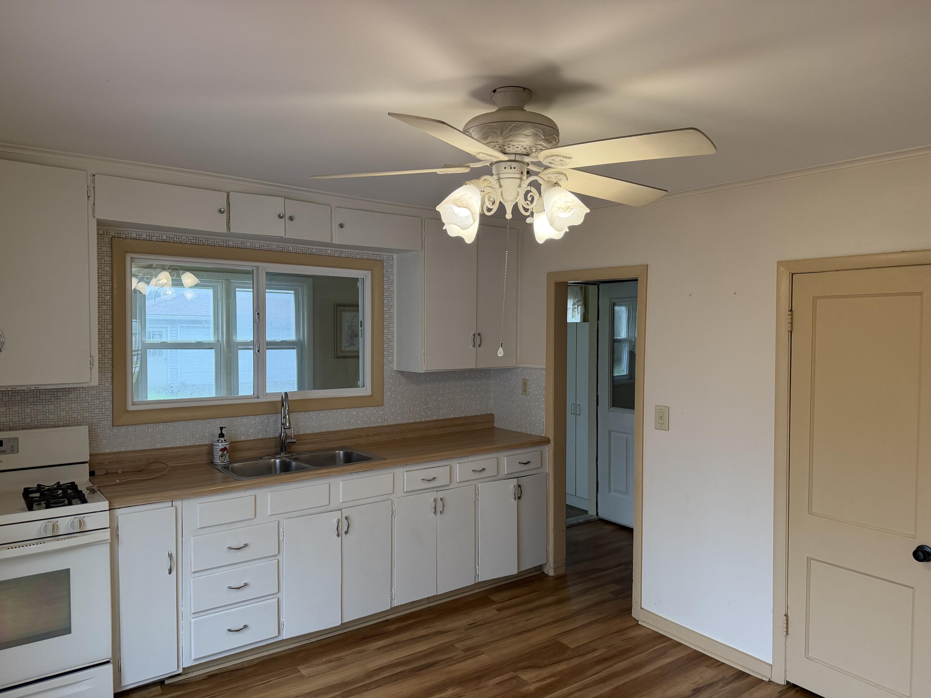 2945 Monnier Street Portage, IN 46368 - Photo 7 of 32 a spacious bathroom with a granite countertop sink a mirror and a