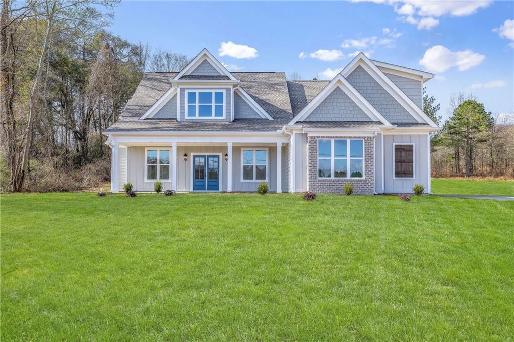 front view of a house with a yard
