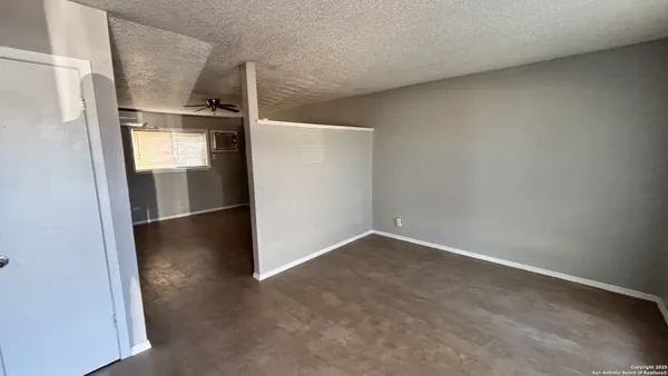a kitchen with stainless steel appliances a sink a stove and white cabinets