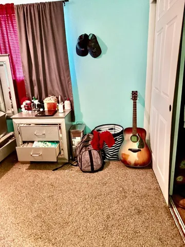 a view of a room with furniture and a window