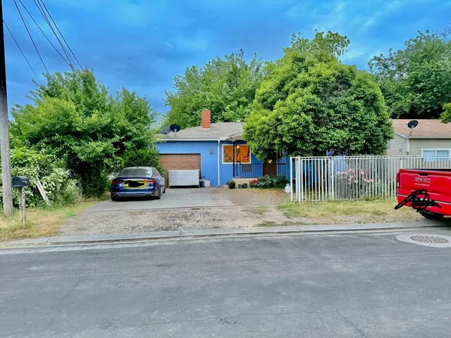 a view of street with parked cars