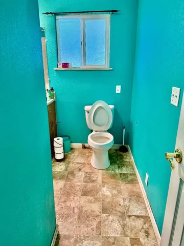a bathroom with a toilet and a sink
