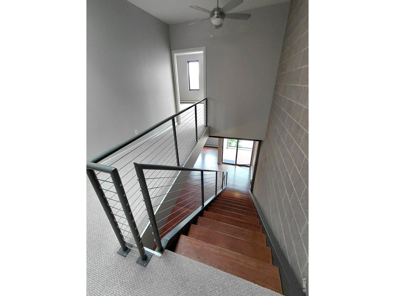 11562 Colony Row Broomfield, CO 80021 - Photo 22 of 24 2nd Floor Halway with stairs down to 1st Floor
