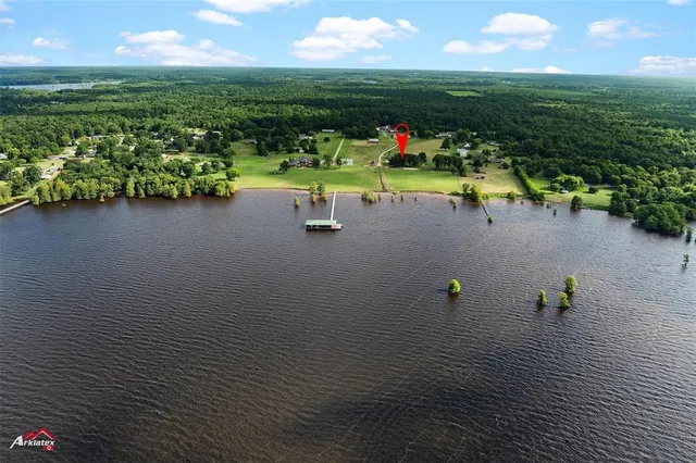 a view of a field with a lake