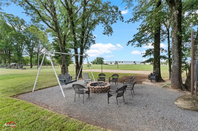 an outdoor space with furniture and garden