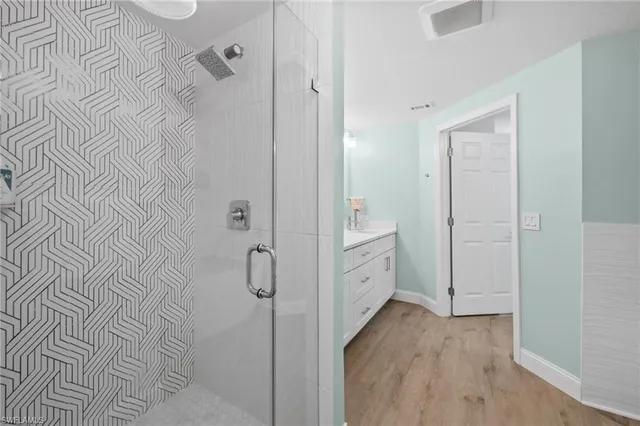 a bathroom with a bathtub and shower