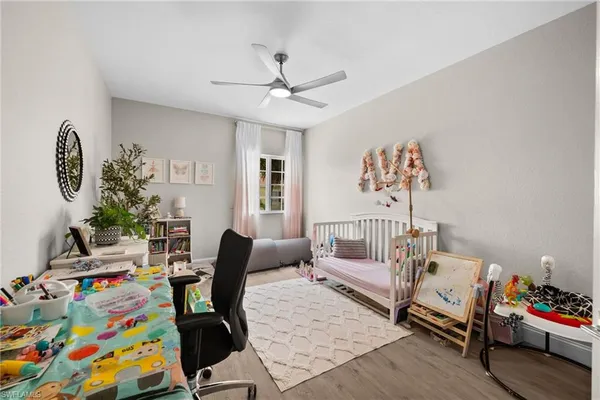 a bedroom with furniture and a chair