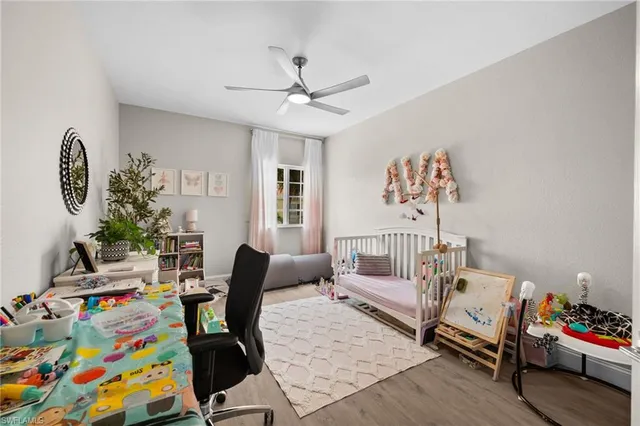 a bedroom with furniture and a chair