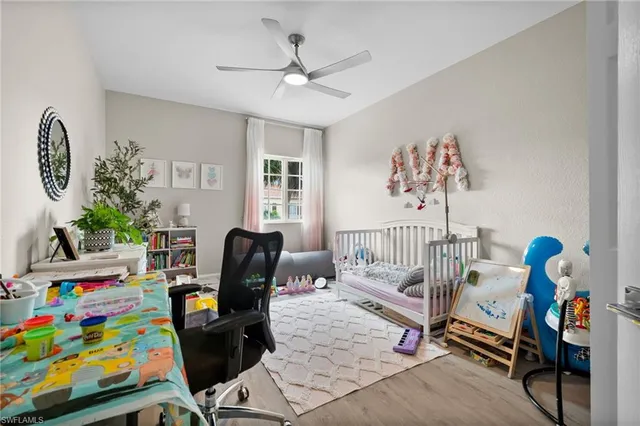 a bedroom with furniture and a window