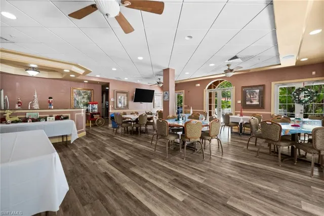 a living room with a couch and bookshelf