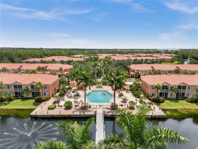 an aerial view of a house with a lake view