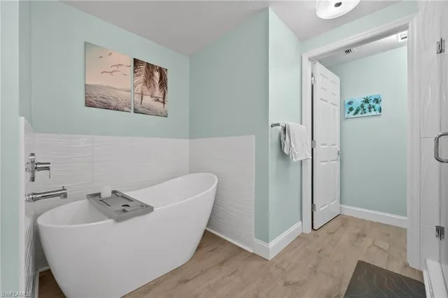 a bathroom with a bathtub and a sink