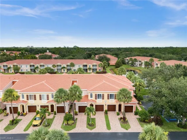 an aerial view of residential houses and city street